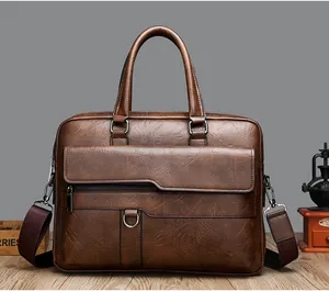 Close-up of dark brown leather briefcase with asymmetric flap pocket and metal D-ring detail