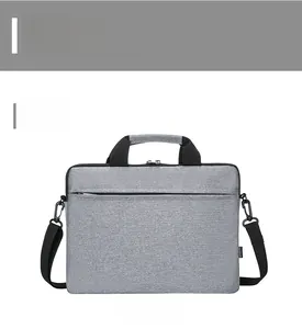 Detailed front view of a gray laptop briefcase showing durable fabric and zipper pocket