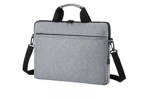 Detailed side view of gray slim laptop bag featuring durable fabric and shoulder strap