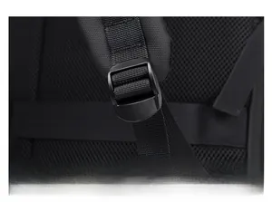 Detail of adjustable shoulder strap with plastic buckle and breathable mesh padding