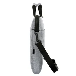 Slim grey fabric laptop briefcase with black handles and detachable shoulder strap