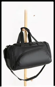 Detail view of water-resistant black gym bag fabric with dual zippers and side mesh pocket