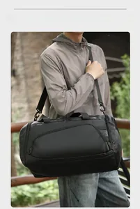 Detail of waterproof black travel bag with high-density fabric and sturdy shoulder strap