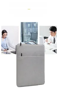 Gray laptop sleeve with top handle and front zipper pocket for office and travel use