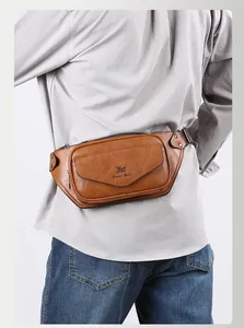 Brown leather men waist bag detail featuring natural grain texture and adjustable belt