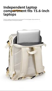Detailed view of the 15.6-inch padded laptop compartment inside the beige travel backpack