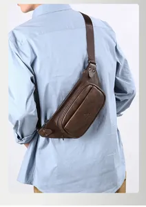 Detailed view of the vintage brown PU leather men's chest bag with metal zipper and logo