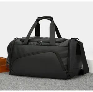 Close-up of black multi-pocket travel bag with durable handles and adjustable shoulder strap