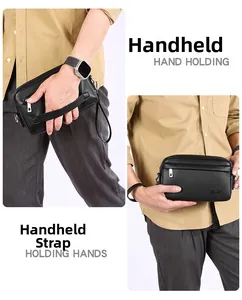 Detail der schwarzen Brusttasche aus PU-Leder mit Narbenstruktur und Handgelenkschlaufe