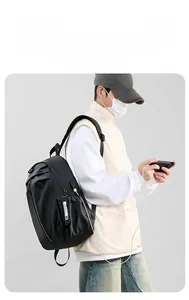 Detail of waterproof nylon backpack featuring a convenient external USB charging port