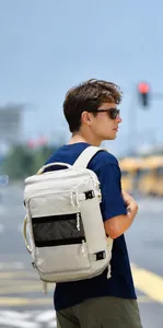 Detail of multi-compartment travel backpack with 15.6 inch laptop sleeve and shoe pocket