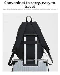 Detail showing back trolley strap of the waterproof black backpack on suitcase handle