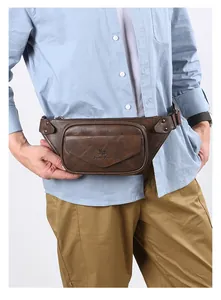 Close-up of brown leather waist bag with flap pocket and adjustable strap for men