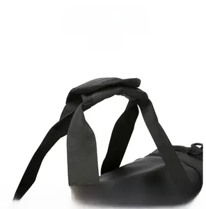 Detail view of reinforced padded handles on a black travel bag for enhanced comfort