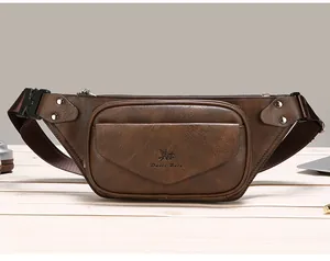 Detail view of the brown leather waist bag with zipper pocket and metal rivet accents