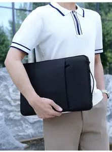 Business laptop sleeve in black water-resistant fabric with handle and zip pocket