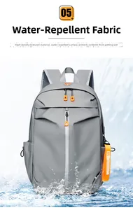 Waterproof detail of gray backpack featuring high-density nylon and orange zipper accents