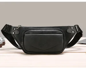 Detailed macro view of black leather fanny pack with embossed logo and metal zipper