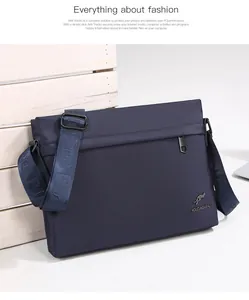 Detail view of navy blue oxford fabric messenger bag with metallic kangaroo logo