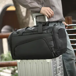 Large black waterproof nylon travel bag with shoe compartment and luggage sleeve