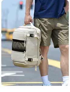 Close-up of beige travel backpack featuring multi-layer zippers and side buckle straps