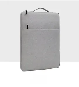 Side view of grey laptop sleeve showing durable fabric texture and portable handle