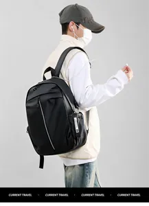 Close-up of black waterproof backpack with USB port and decorative fashion webbing straps
