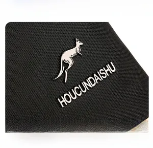 Detailed close-up of the silver kangaroo logo and durable black oxford fabric texture