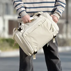Off-white waterproof nylon travel backpack with shoe compartment and side straps