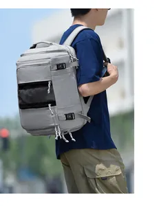 Side view of grey large capacity backpack with adjustable straps and side mesh pockets