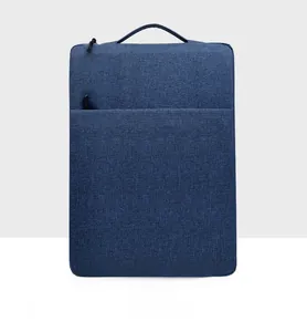 Navy blue laptop sleeve with front zipper pocket and durable woven fabric texture