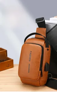 Detail of retro brown leather chest bag with USB charging port on side view