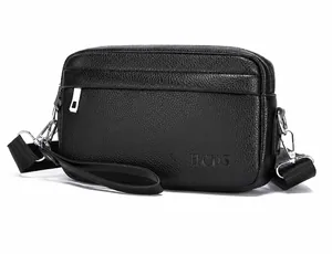 Detailsicht der schwarzen PU-Ledertasche mit Lychee-Maserung, HCDS-Logo und Silberreißverschluss