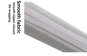 Detail showing smooth invisible zipper on grey linen fabric laptop sleeve close-up