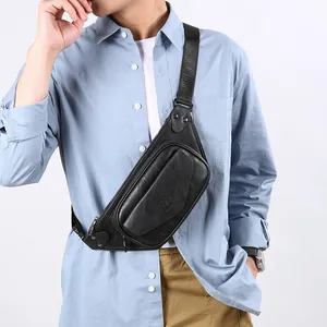Men's black faux leather crossbody bag with adjustable strap worn by model on white background