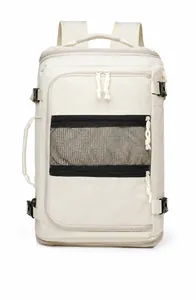 Detailed front view of cream travel backpack showing water-resistant fabric and zippers
