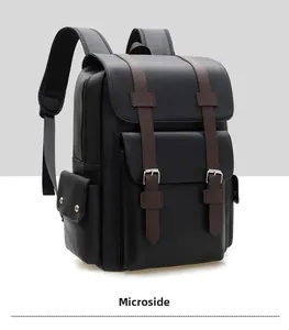 Side view detail of a black litchi grain leather backpack with silver buckle straps