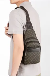 Detail of brown crossbody chest bag with matrix pattern on male model from a side view