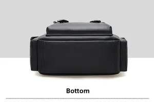 Detailed bottom view of large black lychee texture leather backpack showing stitching