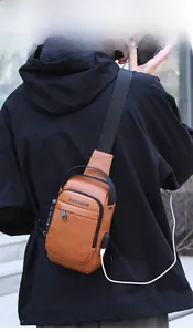 Brown leather sling bag with USB charging port and integrated security padlock