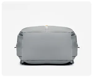 Detailed bottom view of large gray waterproof nylon backpack with reinforced stitching