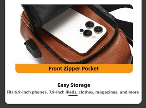 Detail of brown faux leather sling bag showing front zipper pocket with phone storage