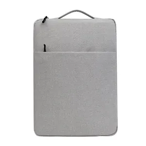 Sleek grey vertical laptop sleeve with top handle and secure zipper for MacBook and tablets
