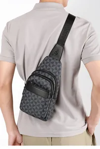 Close-up of geometric pattern crossbody bag showing adjustable strap and zipper details