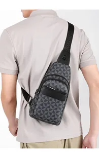 Macro detail of men's chest bag featuring geometric gray texture and branded logo strap