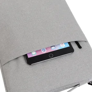 Sleek gray fabric laptop sleeve with outer pocket for Macbook and iPad storage