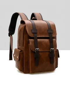 Close-up of vintage brown leather backpack with buckle straps and textured finish