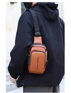 Detailed view of brown leather sling bag with security lock and USB charging port