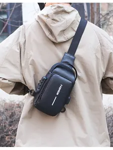Detail of black crossbody bag featuring a security combination lock and a USB charging port