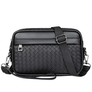 Sac bandoulière homme noir tissé avec bandoulière réglable et fermeture éclair frontale